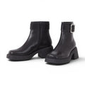 ShoeShop black leather ankle boots with side zip, buckle detail, and chunky platform sole.