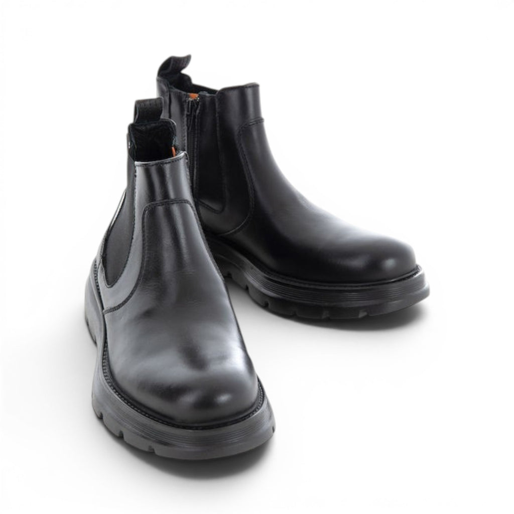 ShoeShop black leather Chelsea boots with elastic side panels and a chunky sole.