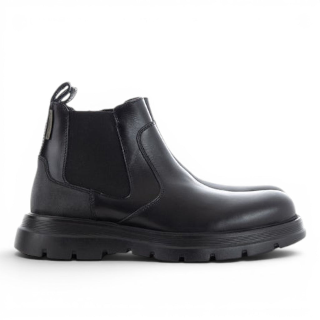 ShoeShop black leather Chelsea boots with elastic side panels and a chunky lug sole.