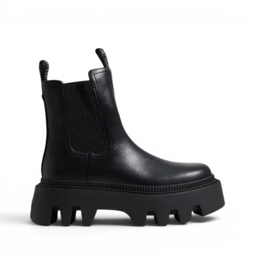 ShoeShop black leather Chelsea boots with elastic side panels and a chunky lug sole.