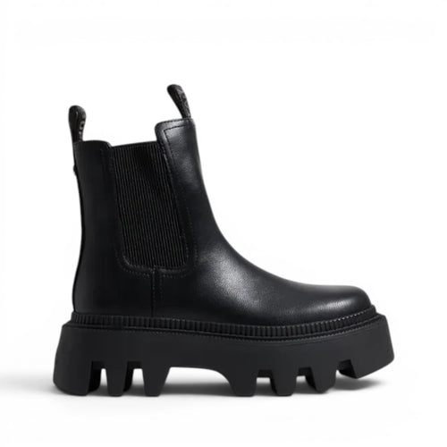ShoeShop black leather Chelsea boots with elastic side panels and a chunky lug sole.