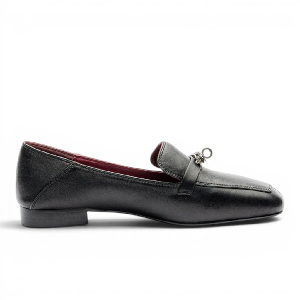 ShoeShop black leather loafers with metal accent and red lining.