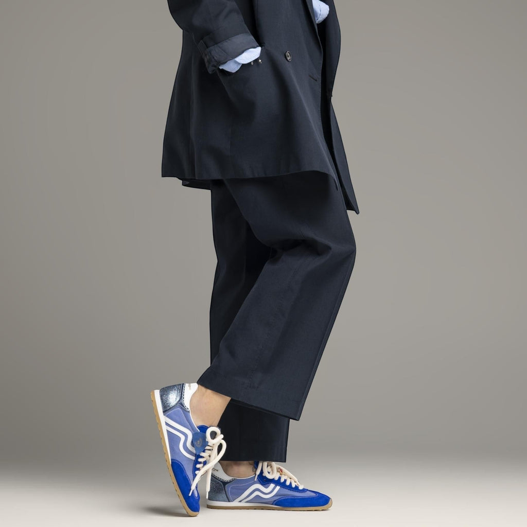 ShoeShop women's blue suede and mesh low-top sneakers with white laces and rubber sole.