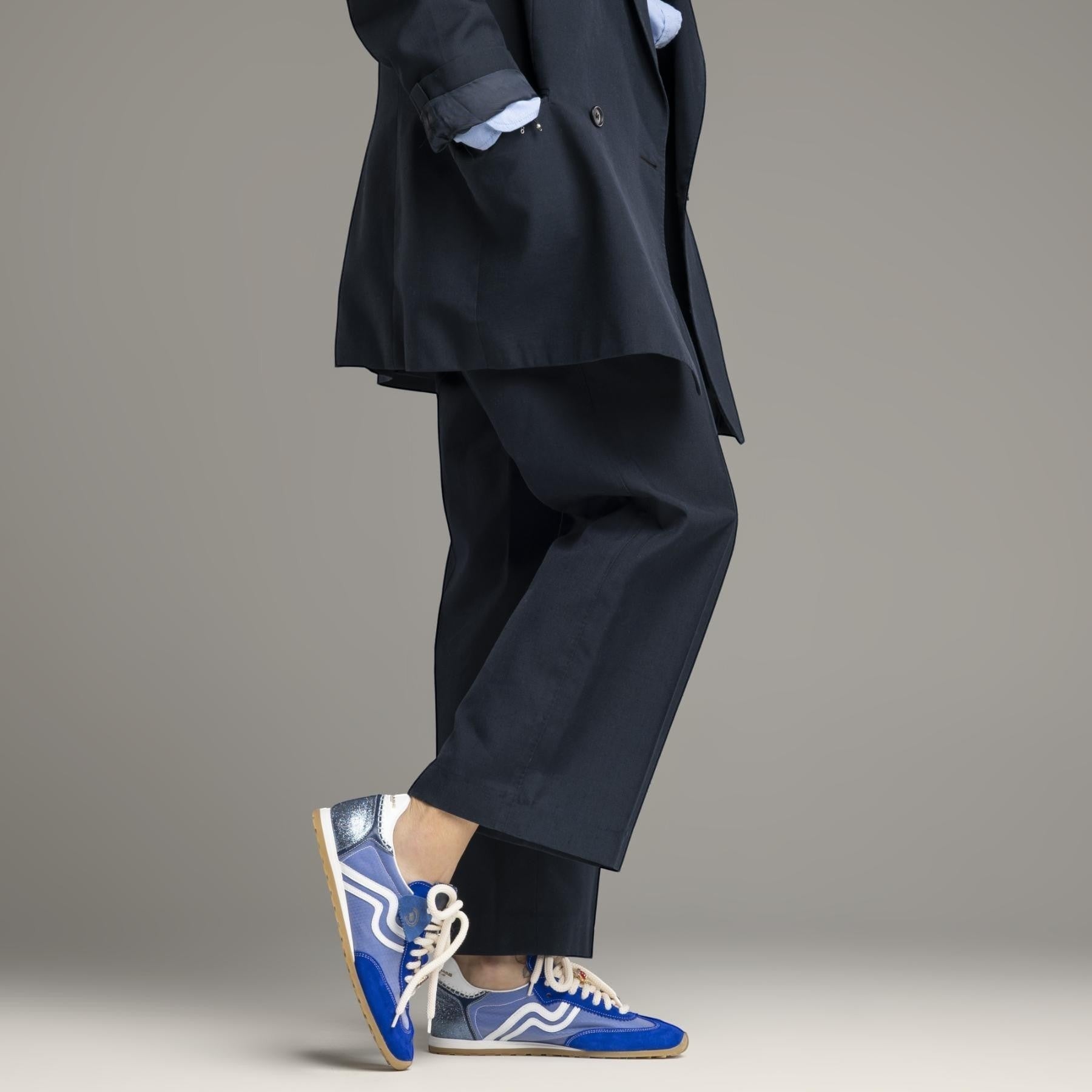 ShoeShop women's blue suede and mesh low-top sneakers with white laces and rubber sole.