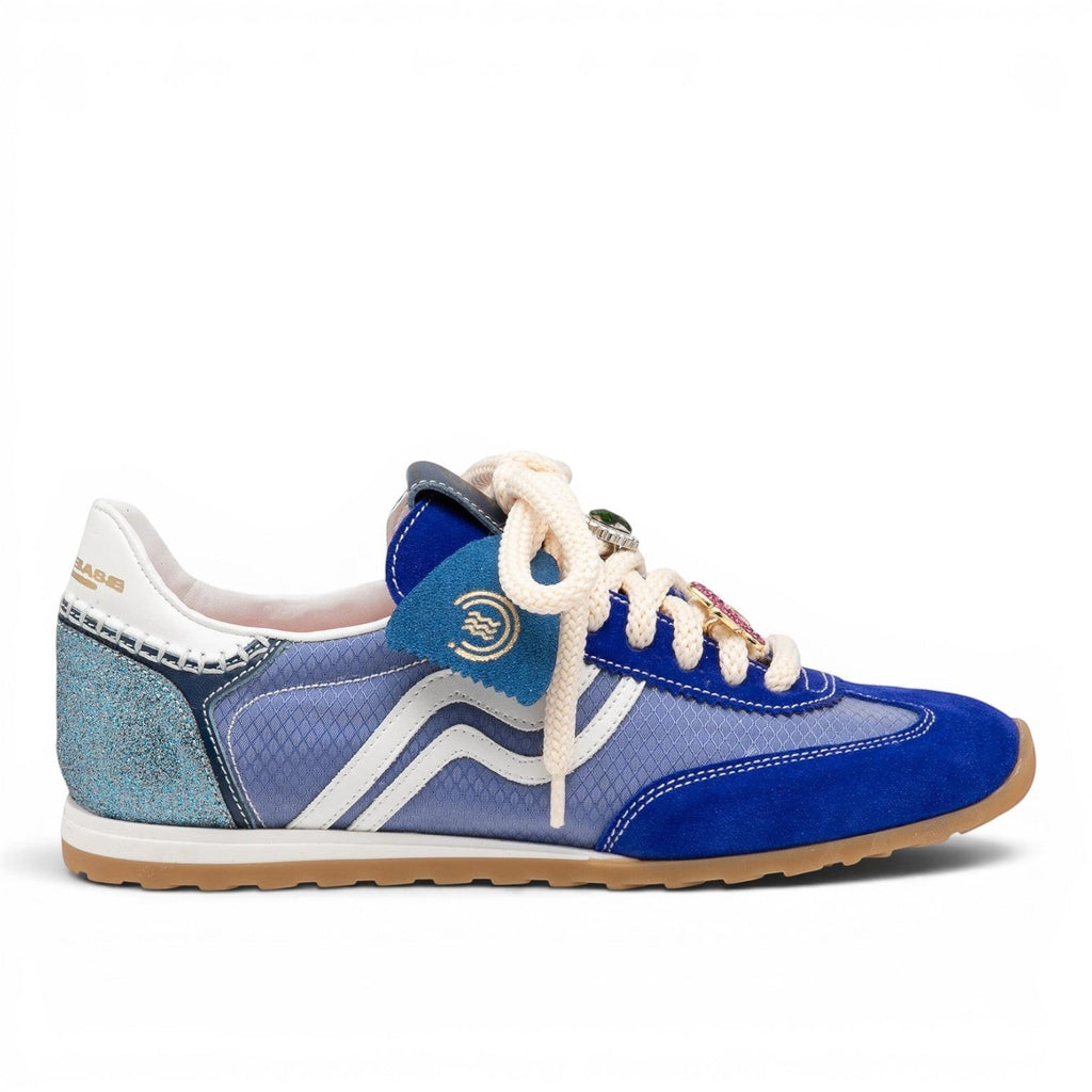 ShoeShop blue suede and mesh low-top sneakers with white stripes and jewel-like lace details.