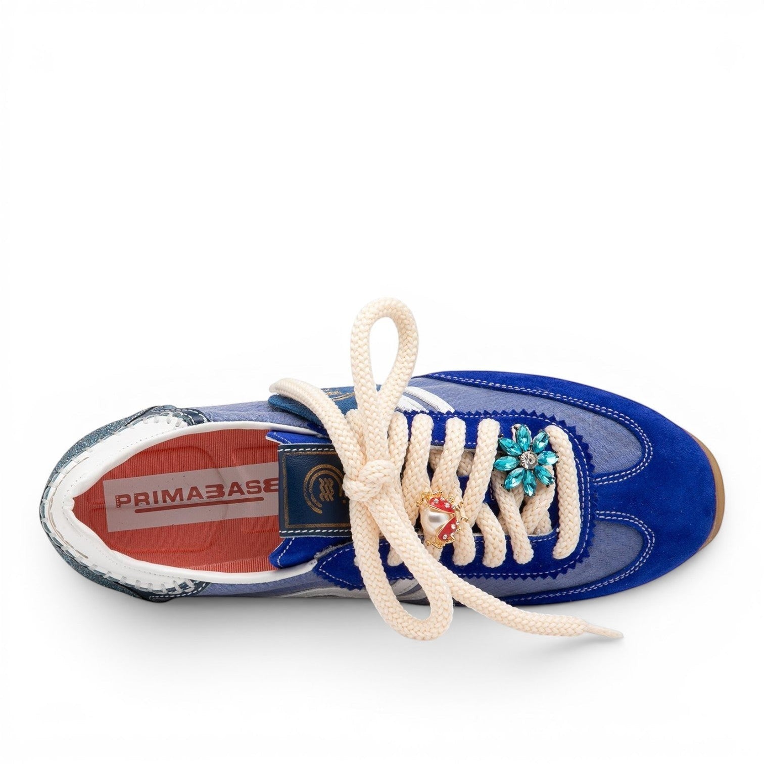 ShoeShop blue suede and mesh women's sneakers with cream laces and jeweled flower detail.