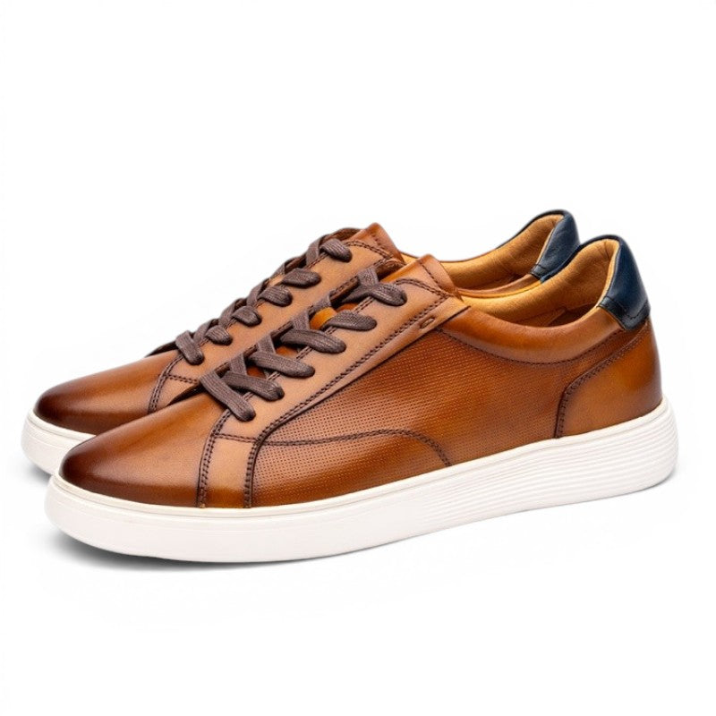 ShoeShop brown leather men's casual sneakers with perforated details and navy heel accent.