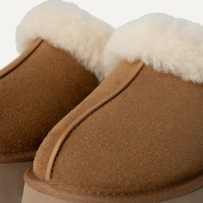 ShoeShop brown suede slippers with white sheepskin lining and a 3cm platform sole.