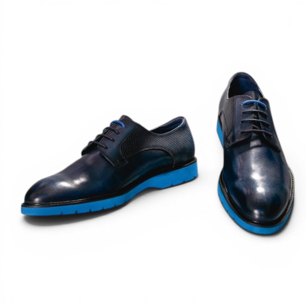 ShoeShop dark blue polished leather derby shoes with textured panels and bright blue rubber soles.