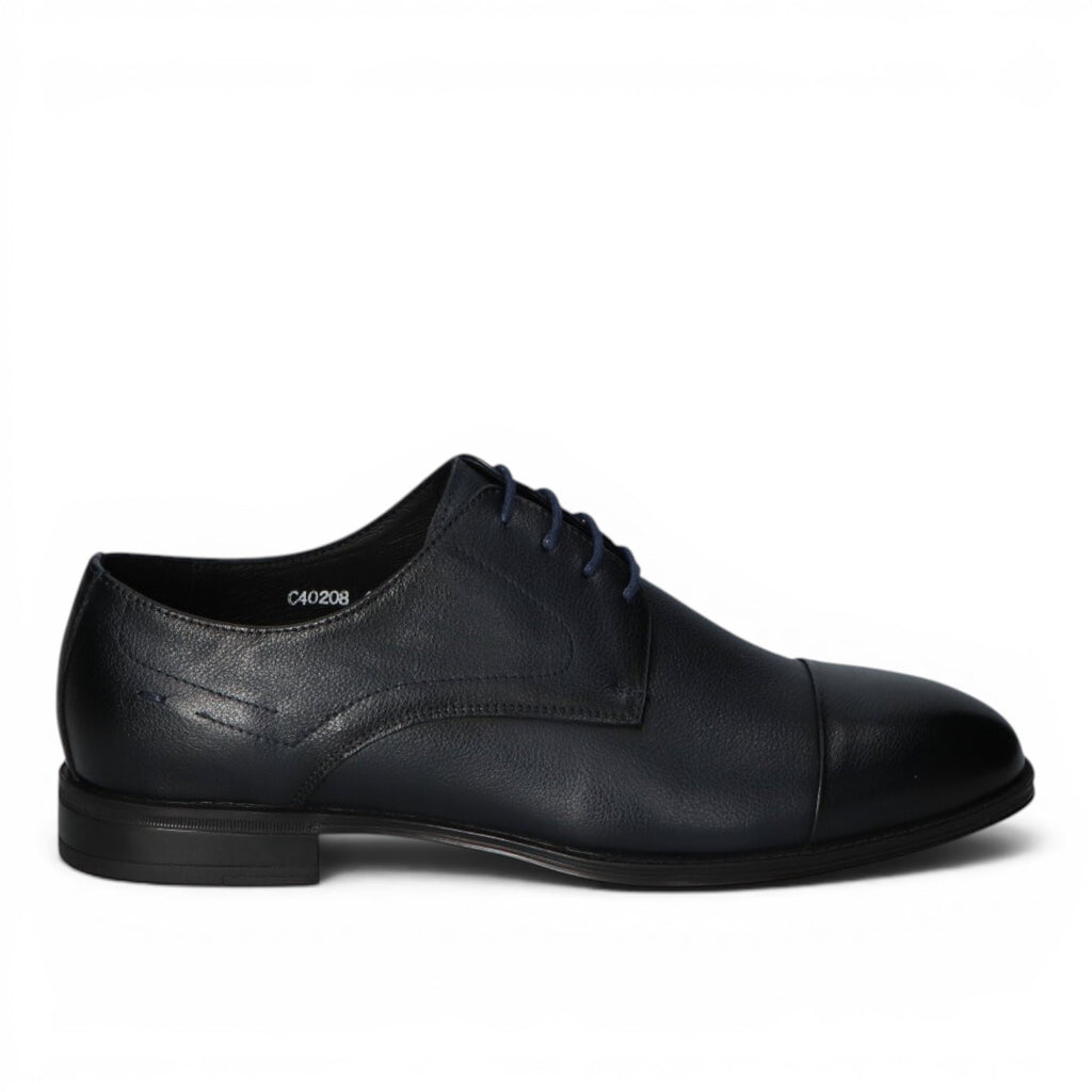 ShoeShop dark blue leather cap toe oxford dress shoe with navy laces and stitched detailing.