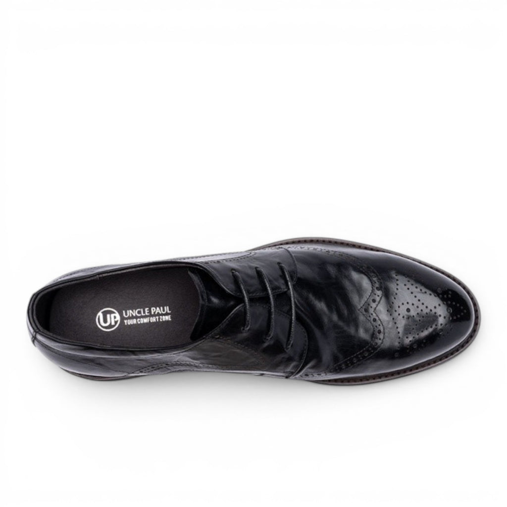 ShoeShop black leather wingtip brogue dress shoes with decorative perforations and lace-up closure.