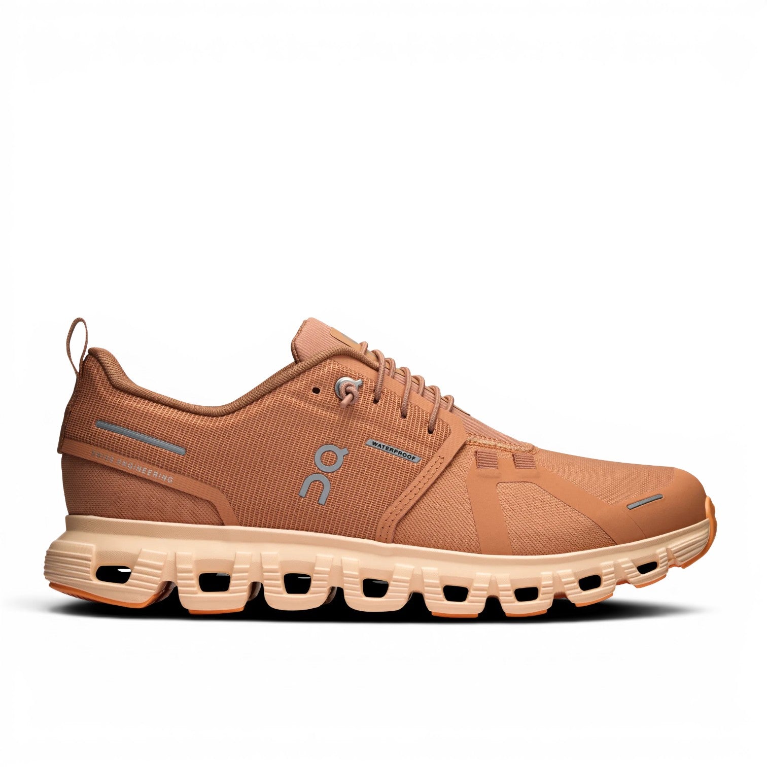 ShoeShop ON Cloud 6 Waterproof running shoes in tan with signature CloudTec sole and reflective details.