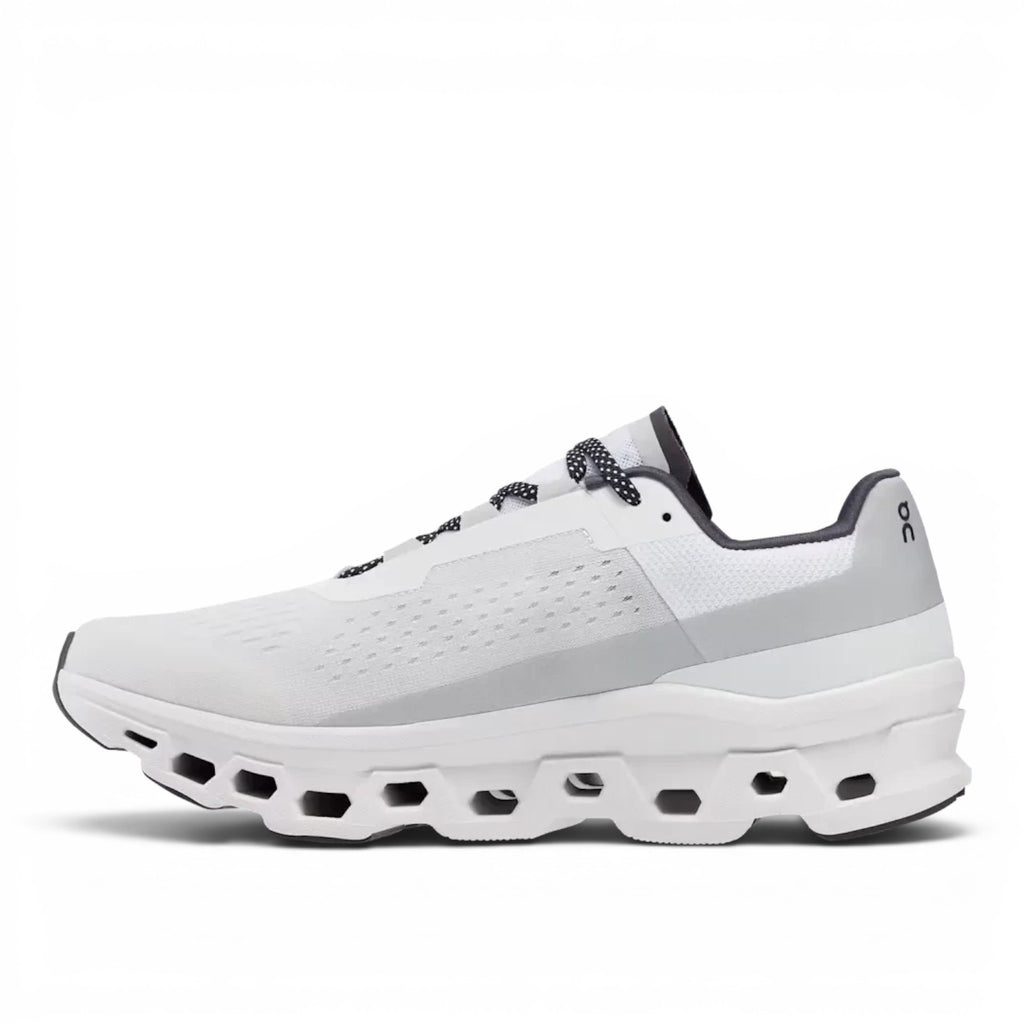 ShoeShop white and grey ON Cloud Cloudmonster running shoe with signature CloudTec cushioning and Speedboard plate.