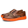 ShoeShop RAINER men's brown leather brogues with plaid textile panels and bright orange rubber soles.