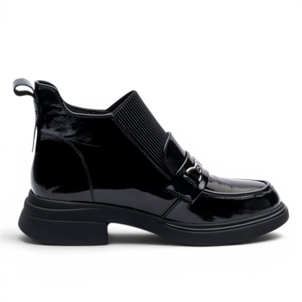 ShoeShop Sonya black patent leather ankle boots with elasticated sides and metal chain detail.