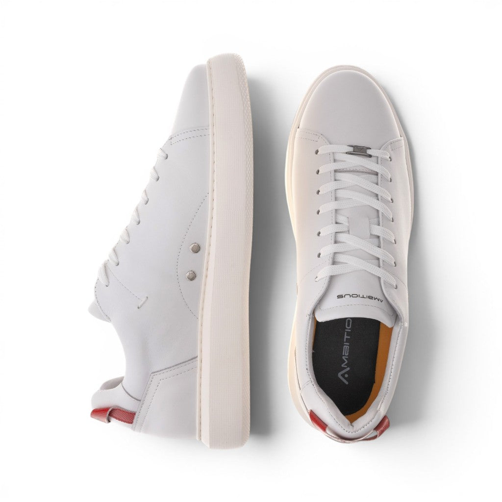ShoeShop white leather low-top sneakers with red heel accents and a thick rubber sole.