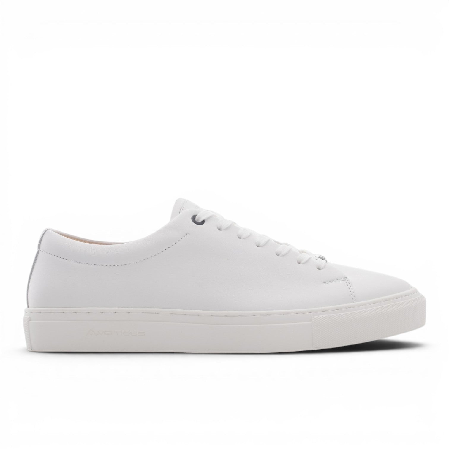 ShoeShop white leather low-top sneakers with lace-up closure and subtle branding on the sole.