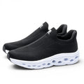 ShoeShopHere black textile slip-on sneakers with white cushioned sole and breathable flyknit upper.