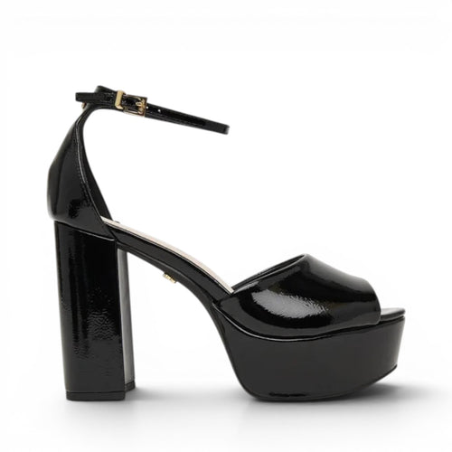 ShoeShop Jessie Neat black patent platform sandals with ankle strap and chunky heel.