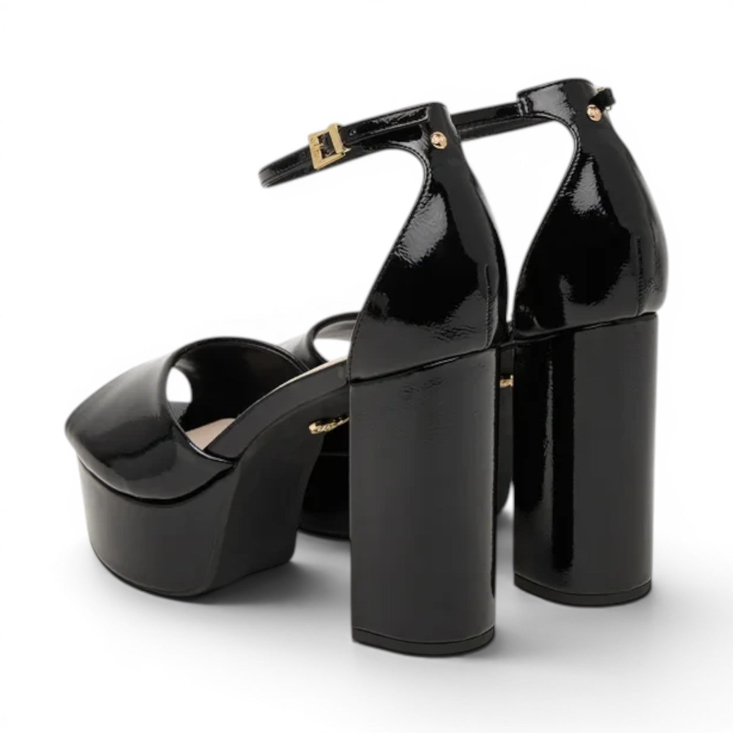 ShoeShop black patent leather platform sandals with ankle strap and chunky heel.