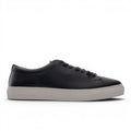 ShoeShopHere black leather low-top sneakers with a light grey sole and lace-up closure.