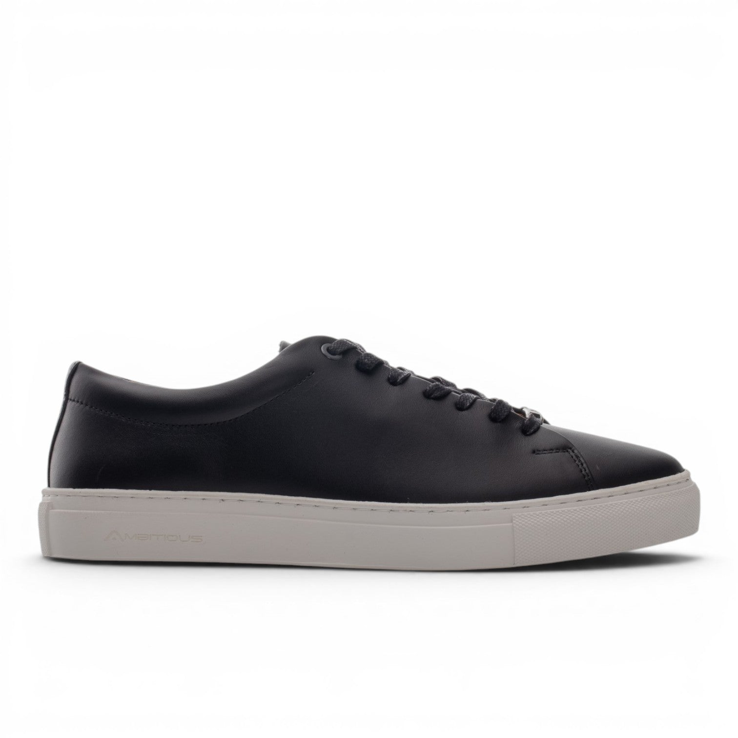ShoeShopHere black leather low-top sneakers with a light grey sole and lace-up closure.