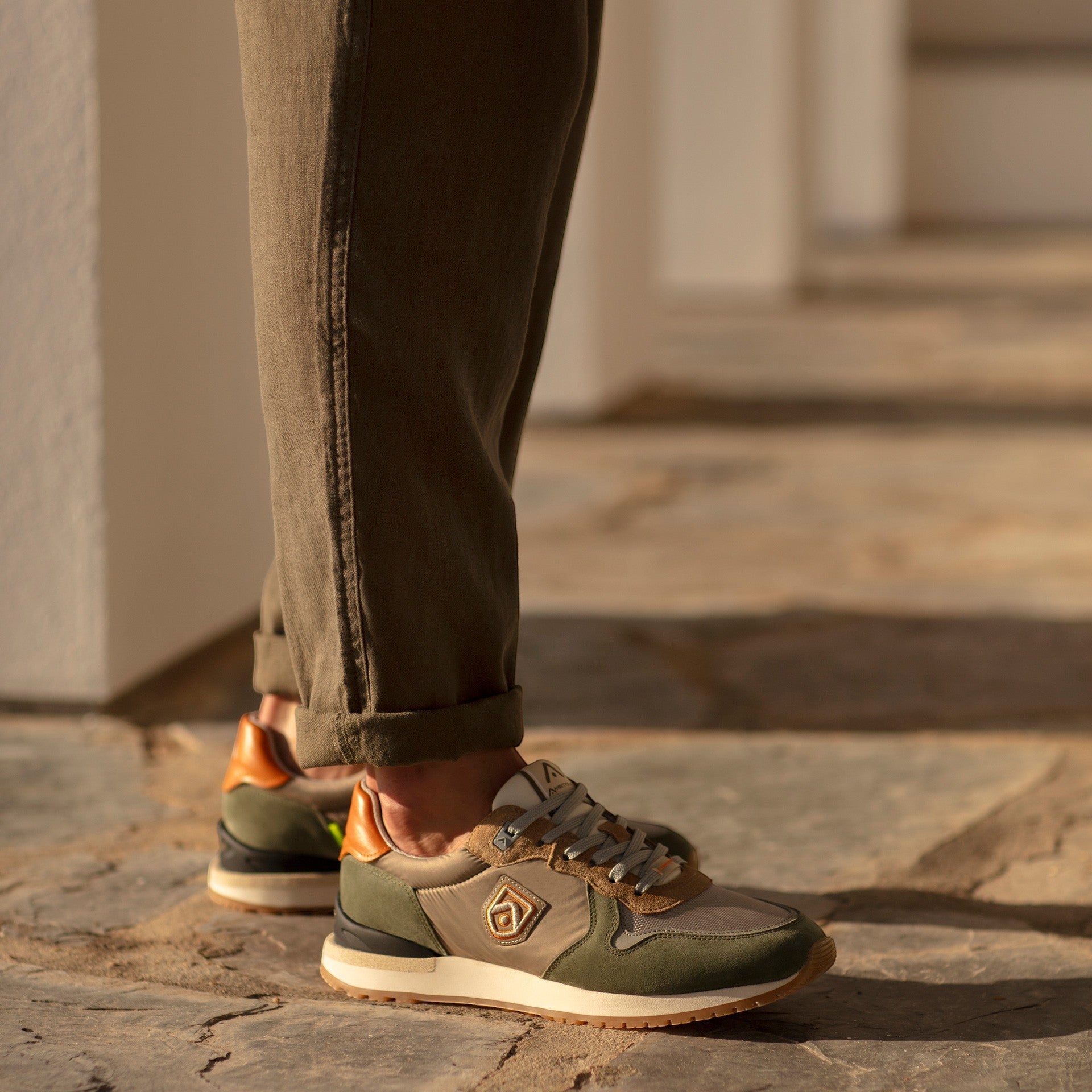 ShoeShop Ambitious 14003 men's sneakers in khaki, olive green, and tan suede with orange heel accents.