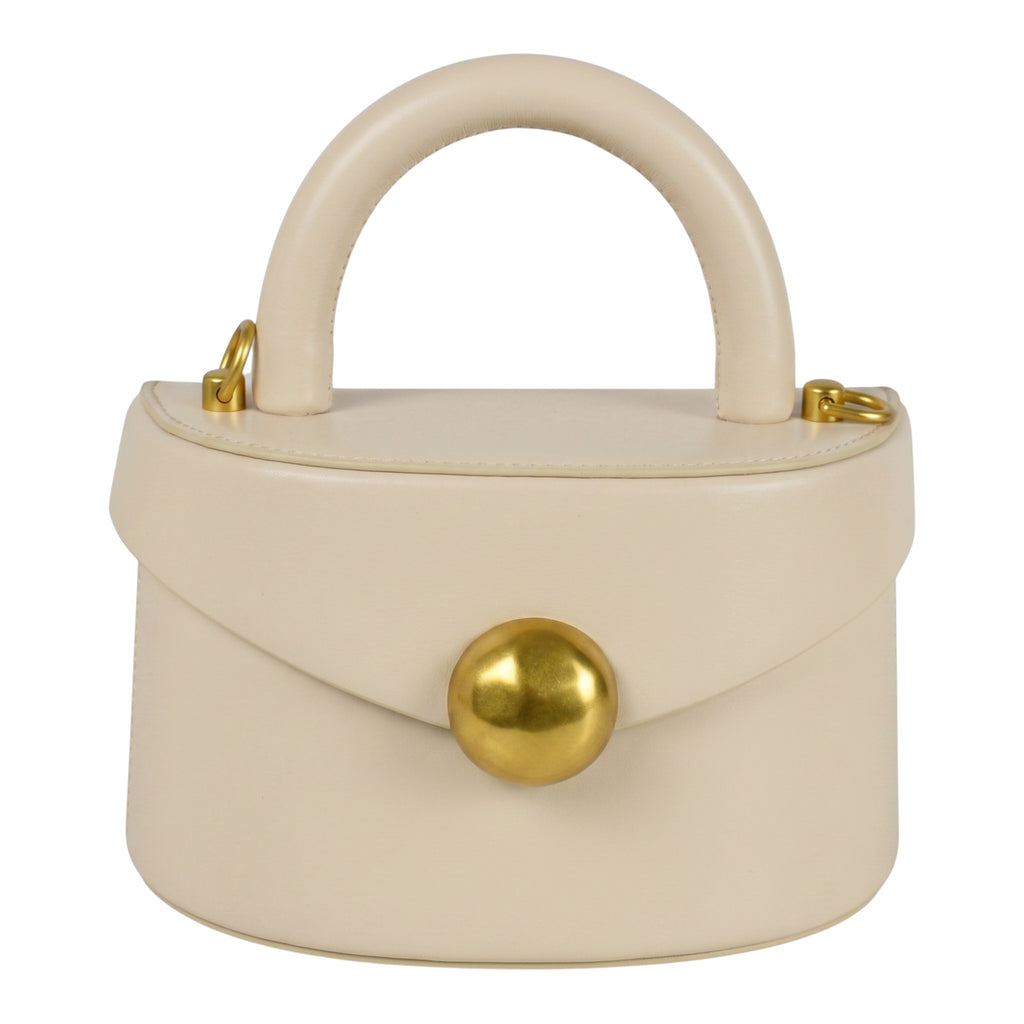 ShoeShop beige leather handbag with a rounded top handle, gold magnetic button closure, and detachable shoulder strap.