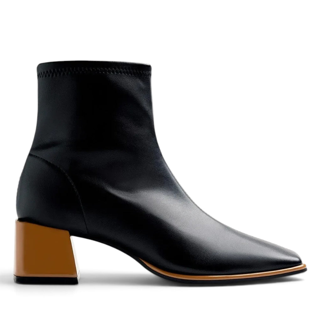ShoeShop black ankle boots with a square toe and a contrasting tan block heel against a white background