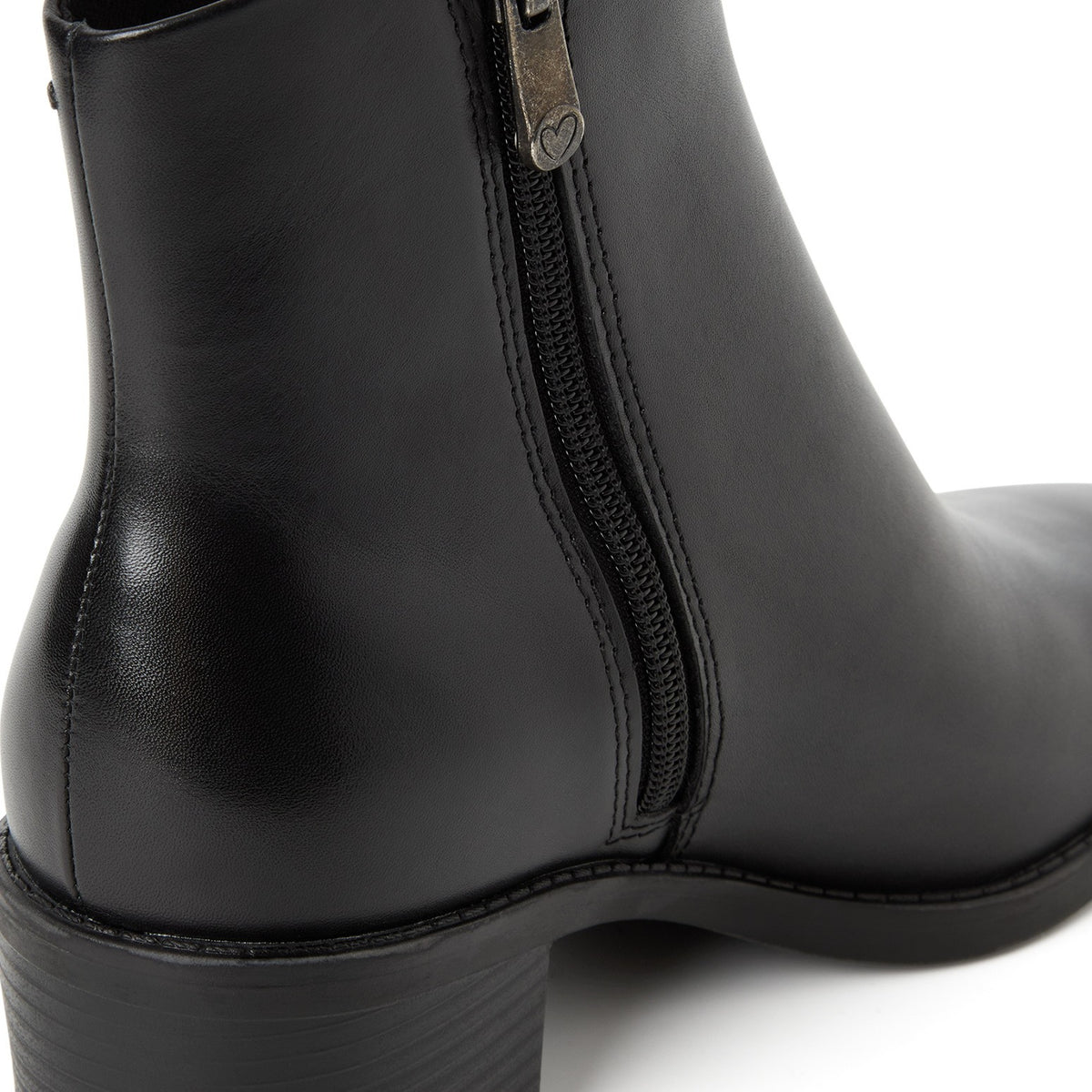 ShoeShop black leather ankle boot with a side zipper featuring a heart-shaped pull tab detail