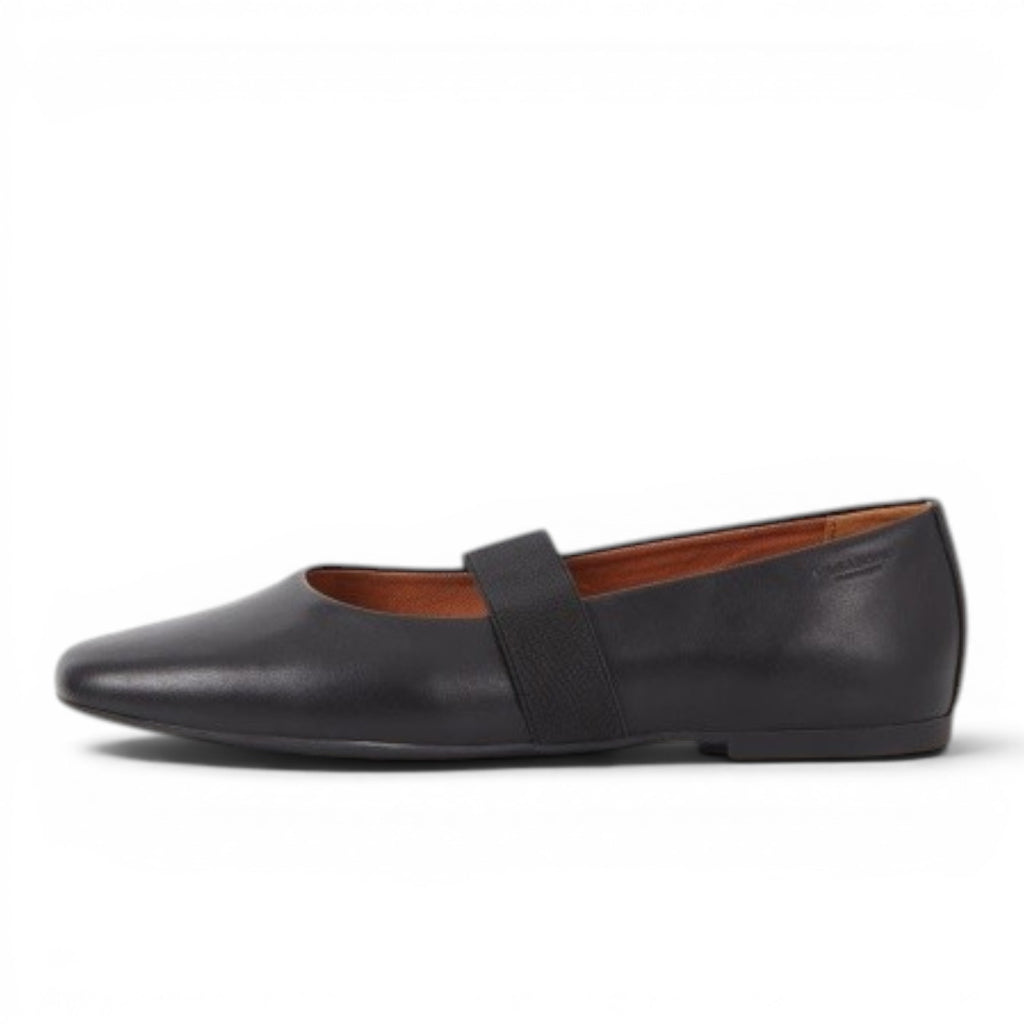 ShoeShop black leather ballet flats with elastic strap and round toe. Low 11mm heel.