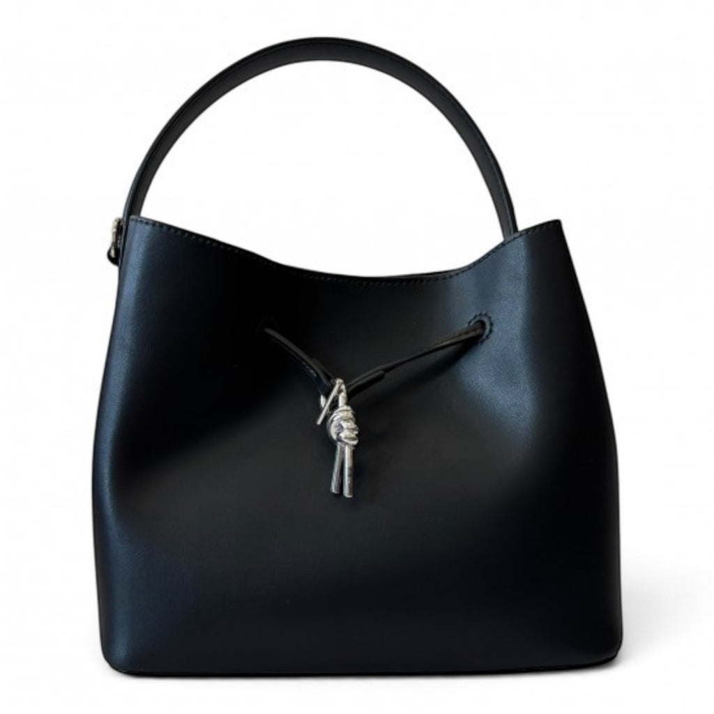 ShoeShop black leather handbag with a top handle, magnetic closure, and decorative silver knot detail.