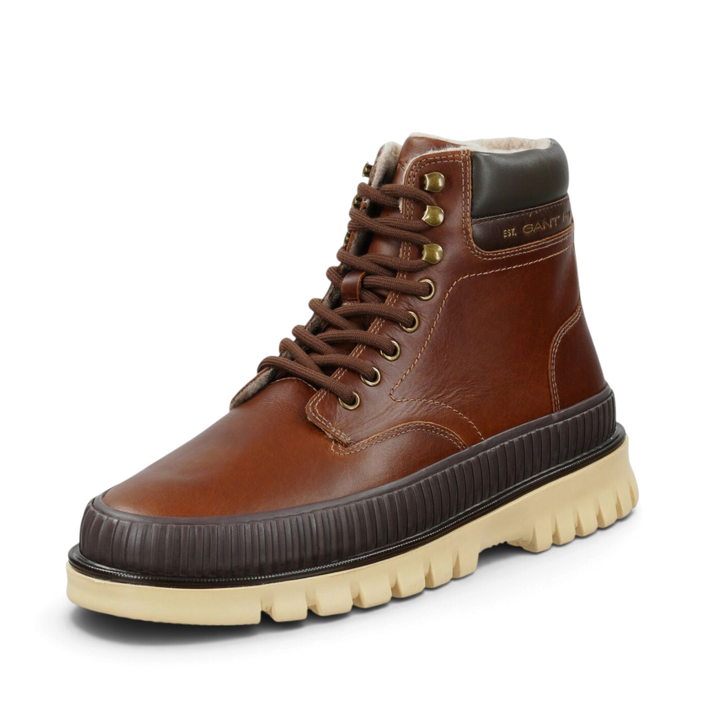 ShoeShop brown leather lace-up winter boots with a thick cream lug sole and warm faux fur lining