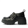 Buffalo 1624090 black faux leather Mary Jane platform shoes with double buckle straps and lug sole.