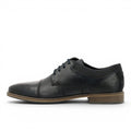 ShoeShop dark blue leather derby shoes with cap toe and suede heel accent. Features lace-up closure and textured side panels.