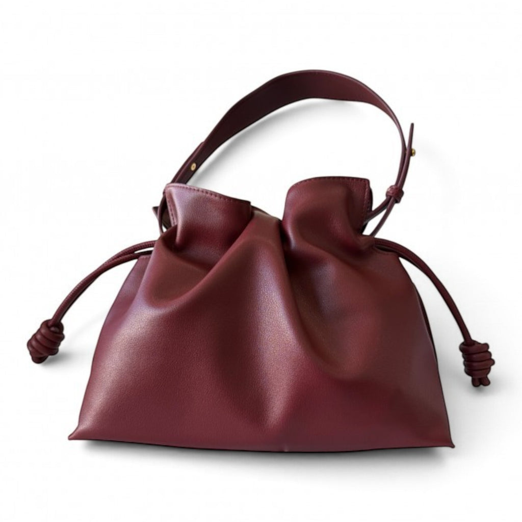 ShoeShop burgundy leather drawstring handbag with a soft slouchy design and a detachable shoulder strap.