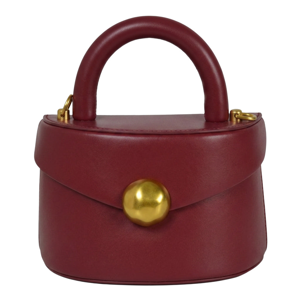 ShoeShop burgundy leather handbag with a top handle, gold magnetic button closure, and detachable shoulder strap.