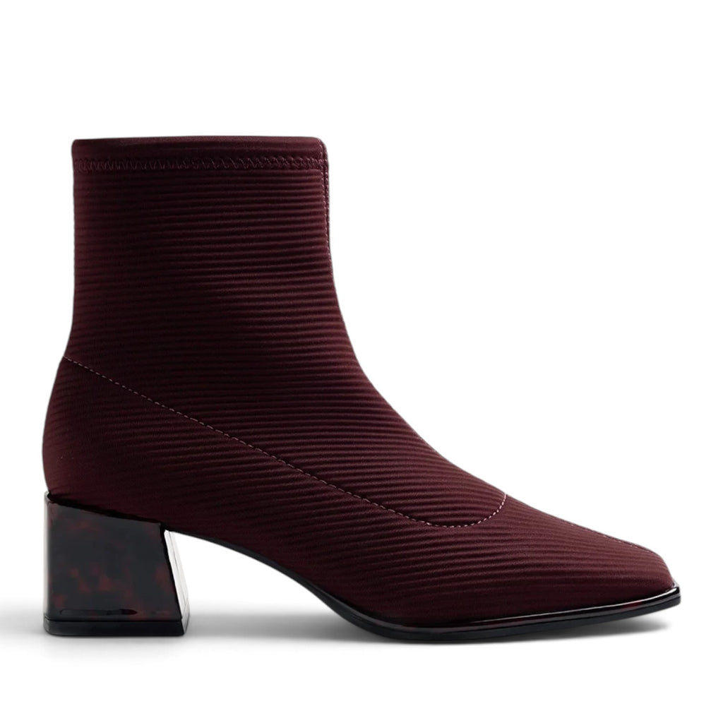 ShoeShop burgundy ribbed knit ankle boot with a square toe and a block heel featuring a tortoiseshell pattern.