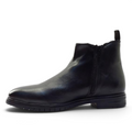 ShoeShop Cafe Moda black leather ankle boots with side zipper and pull tab, side profile view.
