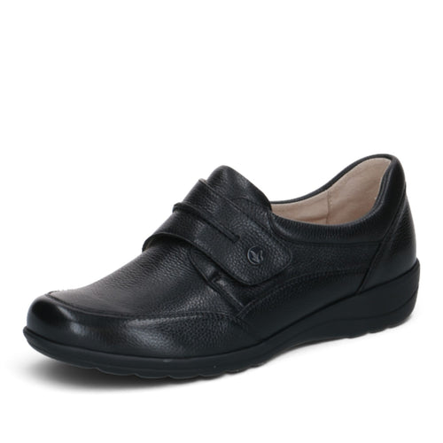 ShoeShop Caprice black leather comfort shoe with a wide H fit, hook-and-loop strap, and durable rubber sole.