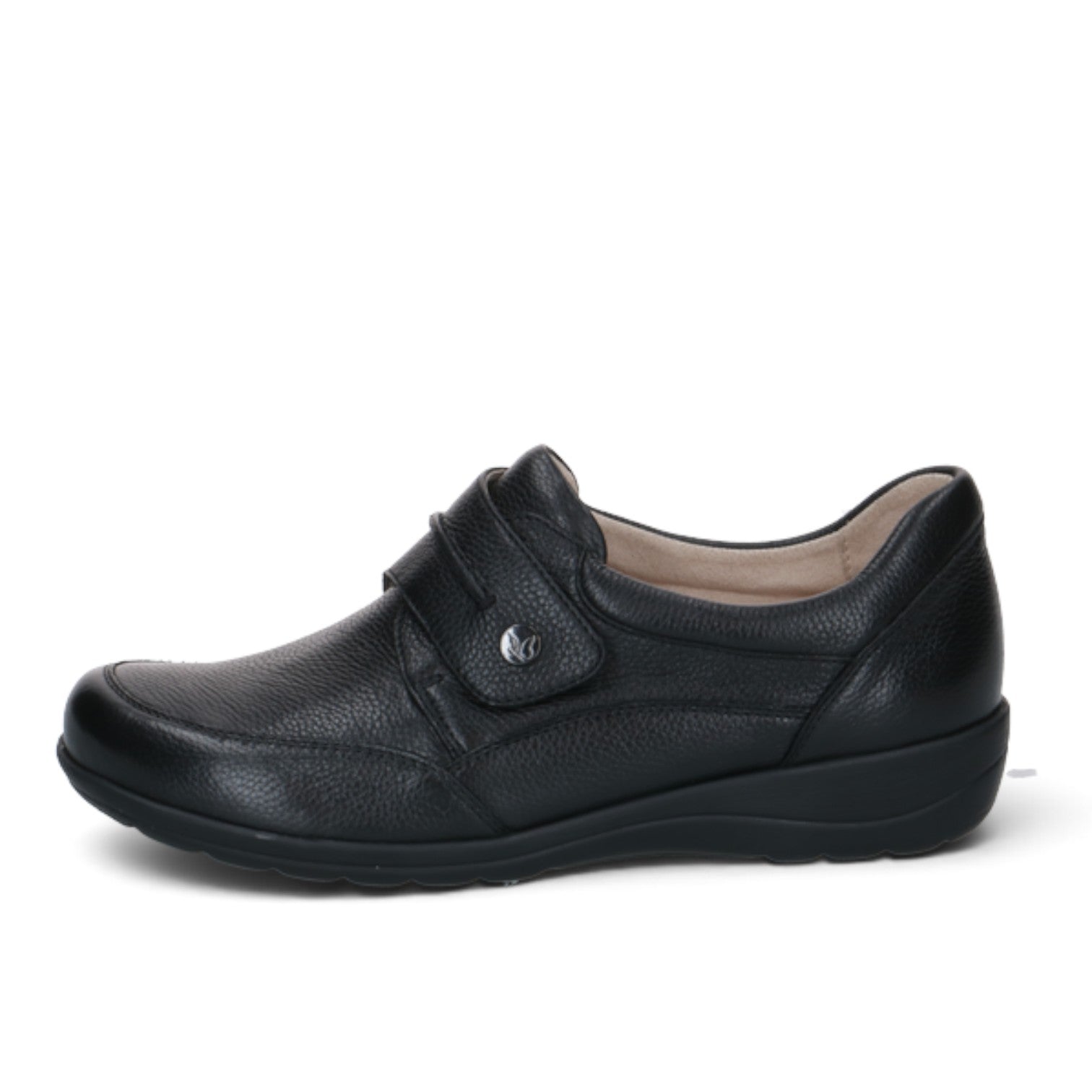 ShoeShop Caprice black leather comfort shoe with a wide H-fit, velcro strap closure, and durable rubber sole.