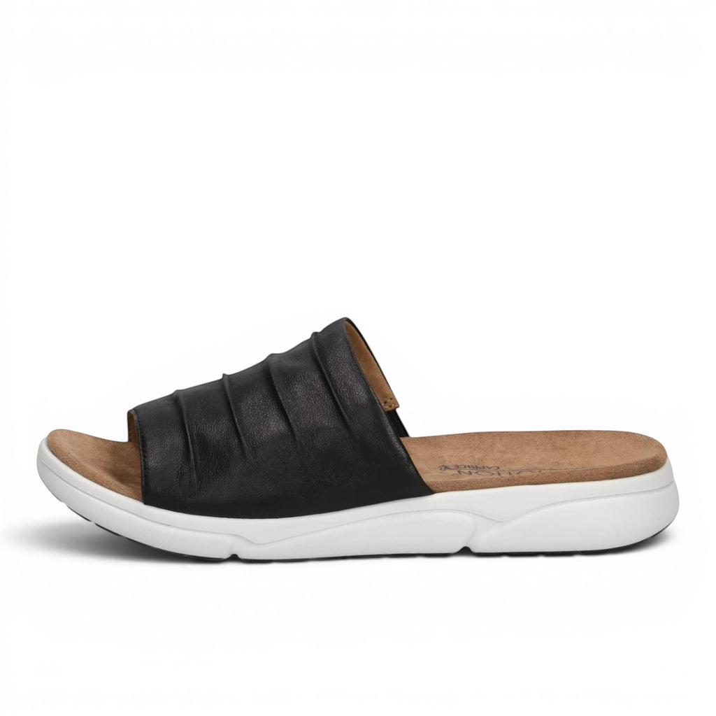 ShoeShop Caprice black leather slide sandals with a comfortable tan footbed and a thick white sporty sole.