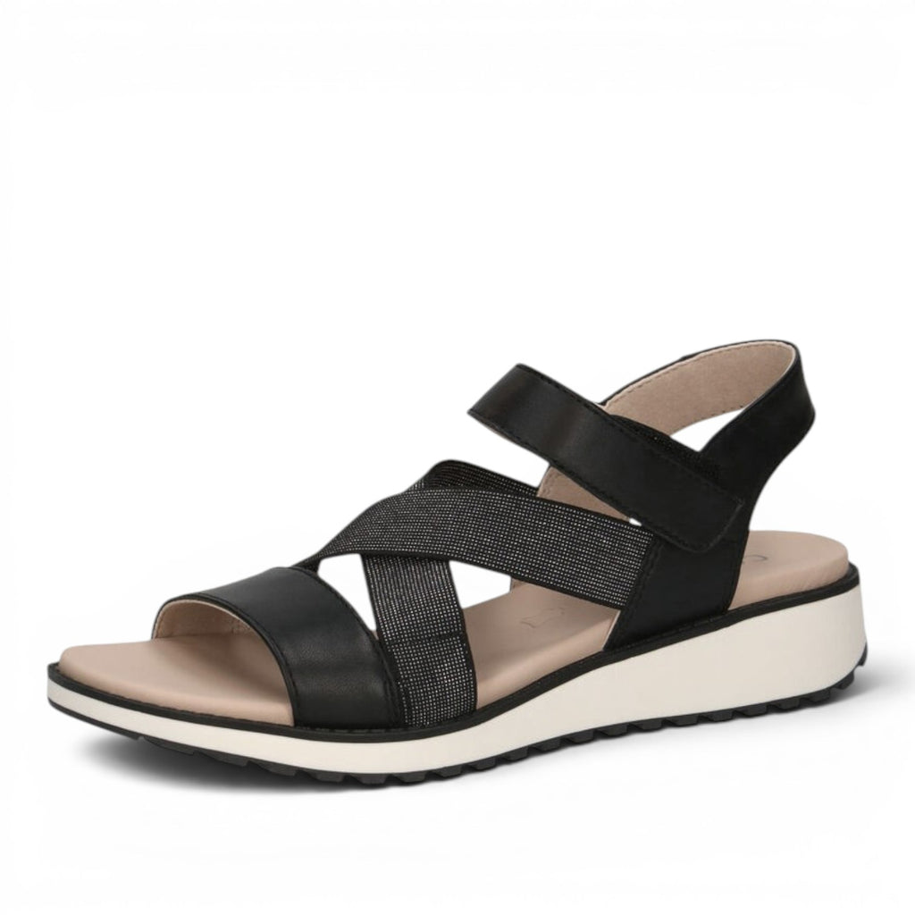 ShoeShop Caprice black strappy sandals with glittery cross-over straps, velcro closure, and a white platform sole.