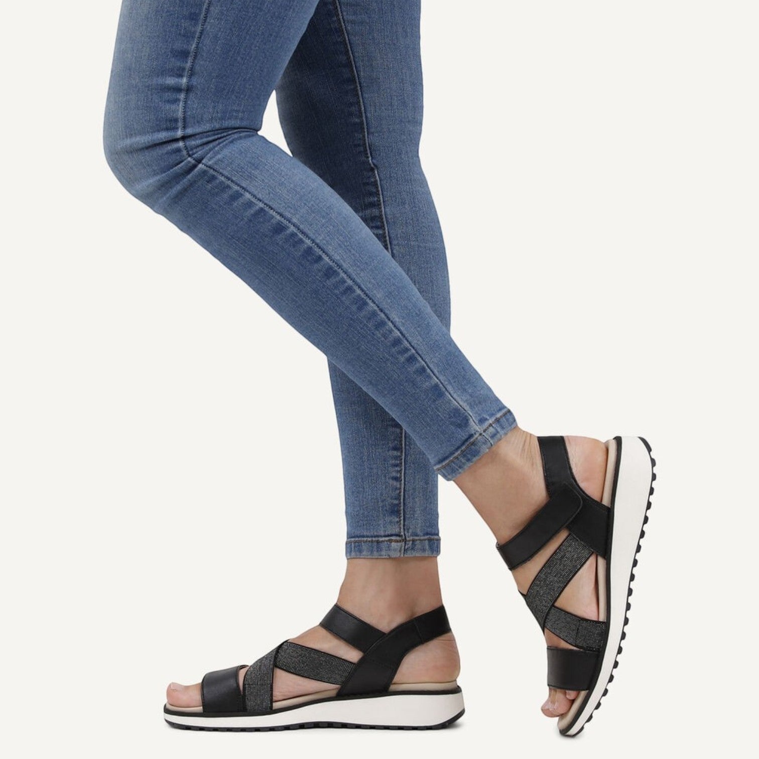 ShoeShop Caprice black strappy sandals with glitter detail and white platform sole worn with blue jeans