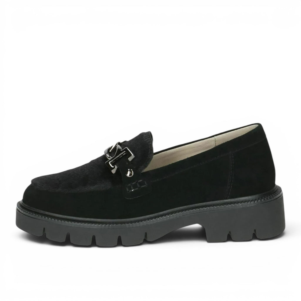 ShoeShop Caprice black textile loafers with a chunky rubber lug sole, metal hardware detail, and removable leather insole