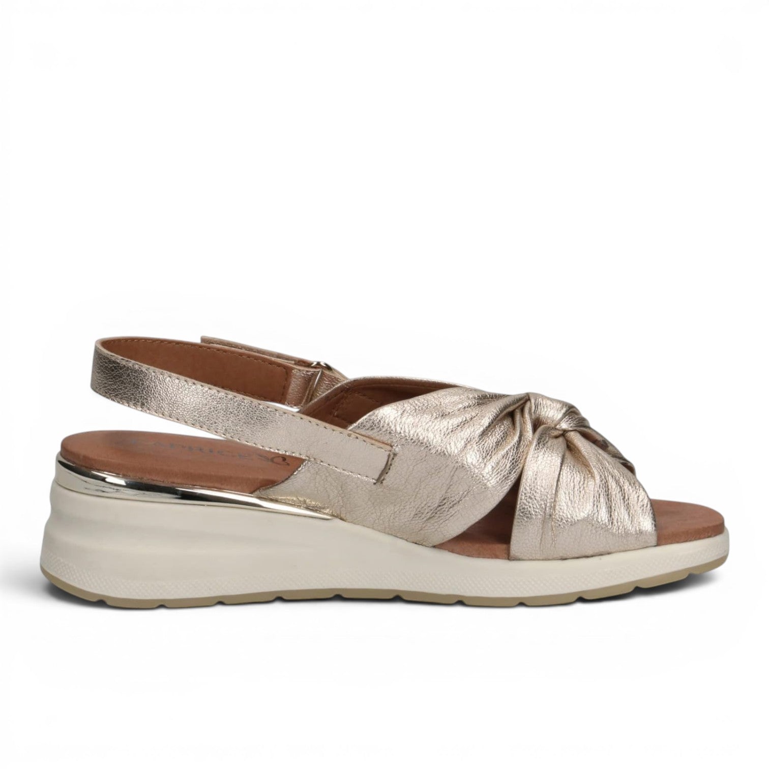 ShoeShop Caprice metallic gold leather wedge sandals with a knotted front strap and adjustable slingback closure.