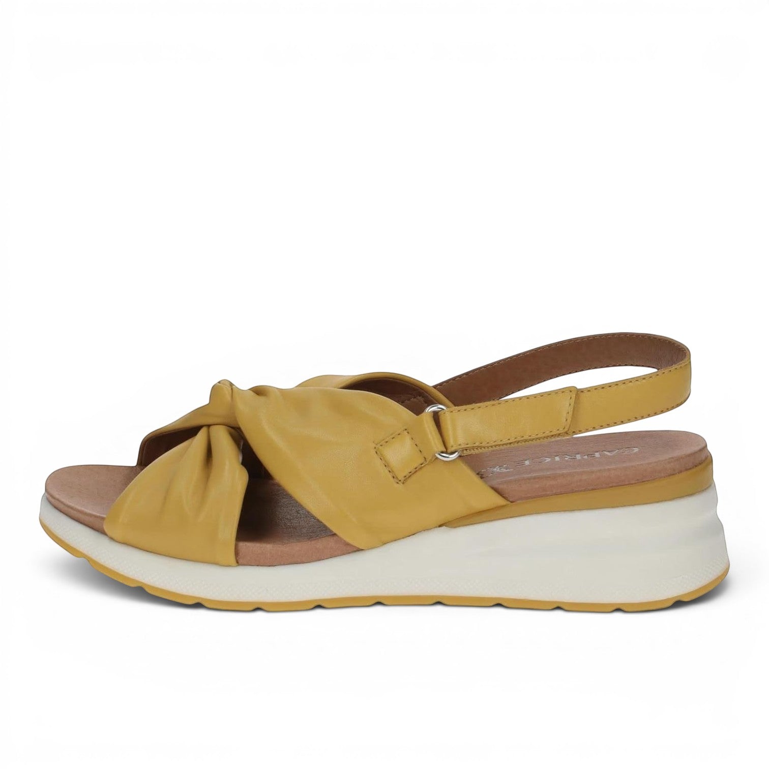 ShoeShop Caprice mustard yellow leather wedge sandals with a knotted front strap and adjustable slingback closure.
