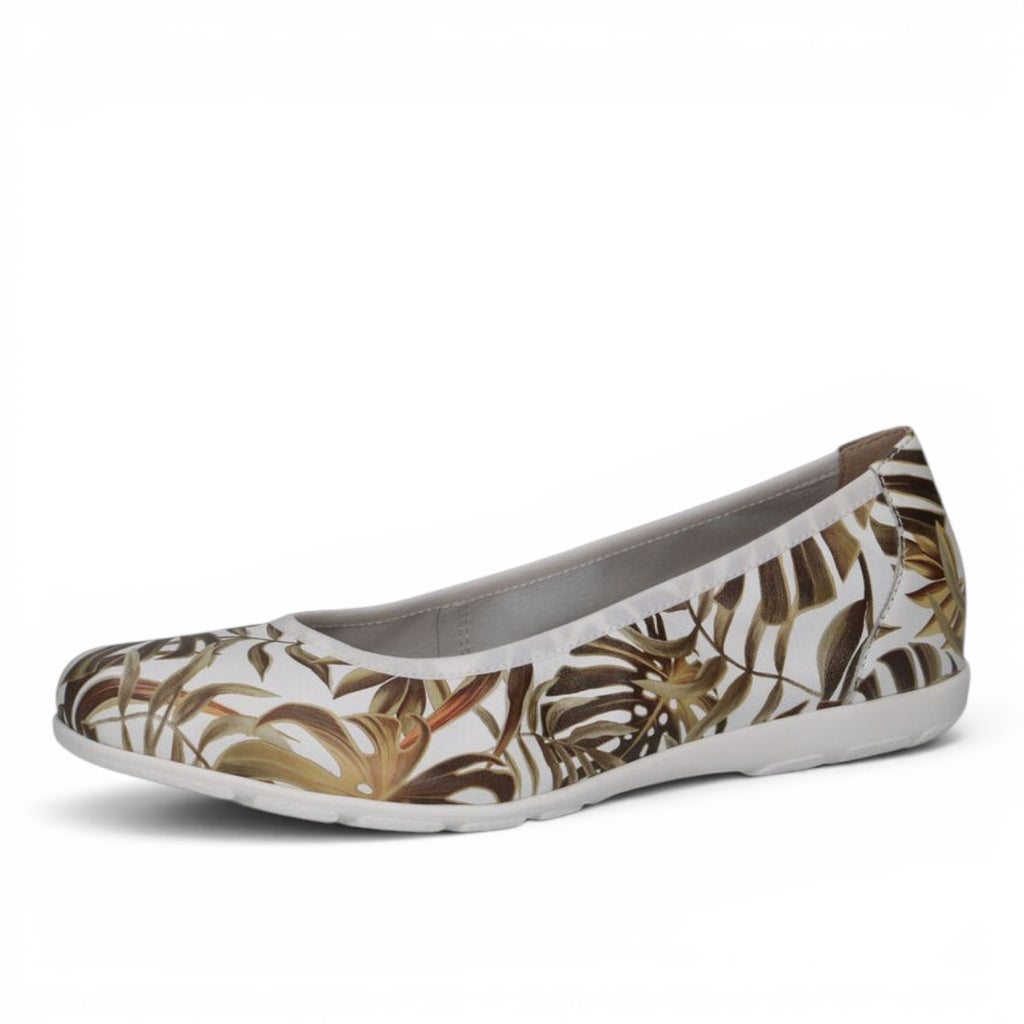 ShoeShop Caprice ballerina flats featuring a white base with a tropical brown leaf print and a comfortable flat sole.
