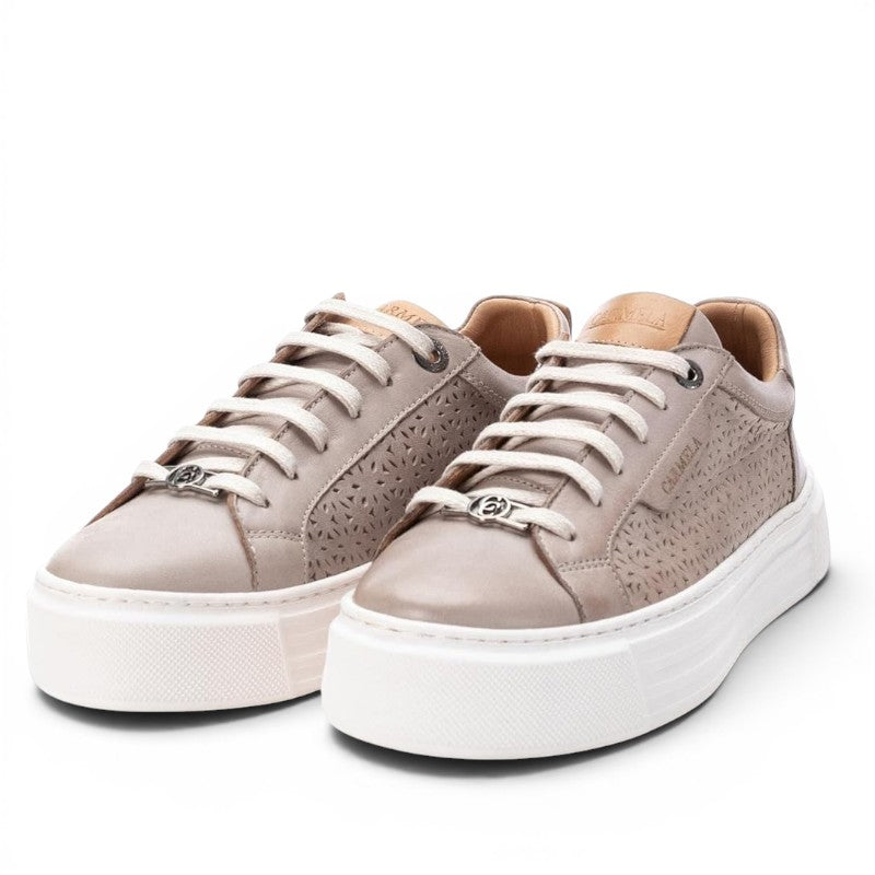 ShoeShop Carmela 160558 taupe leather sneakers with laser-cut floral pattern, white platform sole, and lace-up front.