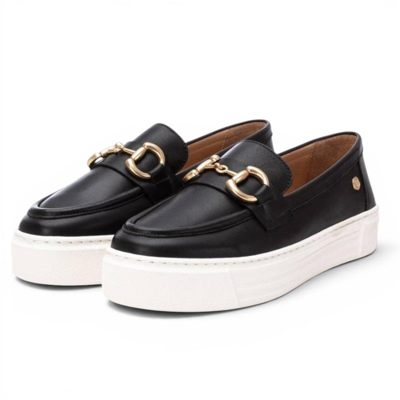 ShoeShop Carmela 161319 black leather loafers with gold horsebit detail and white platform sole.
